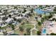 Aerial view of community park with playground, walking paths, and community pools surrounded by desert landscaping at 254 W Amoroso Dr, Gilbert, AZ 85233