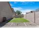 Inviting backyard with low-maintenance artificial turf, a relaxing hammock, and minimalist gravel landscaping at 254 W Amoroso Dr, Gilbert, AZ 85233