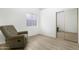 Bedroom featuring wood floors, natural light and a mirrored closet at 254 W Amoroso Dr, Gilbert, AZ 85233
