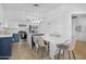 Eat-in kitchen showcases a breakfast bar with pendant lighting and stainless steel appliances at 254 W Amoroso Dr, Gilbert, AZ 85233
