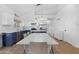 Spacious kitchen with marble counters, blue cabinets, stainless appliances, and an eat-in dining area at 254 W Amoroso Dr, Gilbert, AZ 85233