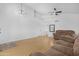 Bright open living room with vaulted ceiling, wood floors, and large windows at 254 W Amoroso Dr, Gilbert, AZ 85233