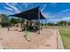 Community park with playground, covered seating, and desert landscaping at 254 W Amoroso Dr, Gilbert, AZ 85233
