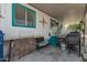 Covered backyard patio with a grill, counter space, and outdoor seating at 2650 W Union Hills Dr # 164, Phoenix, AZ 85027