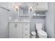 Bright bathroom featuring a toilet, sink, vanity, and plenty of storage at 2650 W Union Hills Dr # 164, Phoenix, AZ 85027