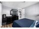 Warm bedroom featuring a comfortable bed, dresser, and doorway to the kitchen at 2650 W Union Hills Dr # 164, Phoenix, AZ 85027