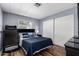 Bedroom featuring an exercise machine and matching dark furniture, with wood-look floors at 2650 W Union Hills Dr # 164, Phoenix, AZ 85027