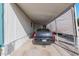 Carport featuring a black 4-door sedan parked on the concrete pad at 2650 W Union Hills Dr # 164, Phoenix, AZ 85027