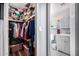 Bathroom featuring a shower, toilet, vanity with cabinet, and a view of a full walk in closet at 2650 W Union Hills Dr # 164, Phoenix, AZ 85027