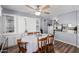 Dining area with chandelier lighting, wood floors, and built-in cabinet with decorative items at 2650 W Union Hills Dr # 164, Phoenix, AZ 85027