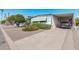 Charming home exterior with carport, manicured landscaping, and a spacious driveway at 2650 W Union Hills Dr # 164, Phoenix, AZ 85027