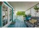 Covered porch features cozy seating with decor and views of the surroundings at 2650 W Union Hills Dr # 164, Phoenix, AZ 85027