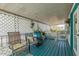 Covered porch with cozy seating and decor, creating a relaxing outdoor space at 2650 W Union Hills Dr # 164, Phoenix, AZ 85027