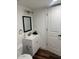 Updated bathroom features a bright vanity, stylish fixtures, and wood-look flooring at 2721 E Beverly Ln, Phoenix, AZ 85032