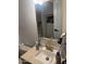 Traditional bathroom with neutral wall paint and a sink with a gold faucet at 2721 E Beverly Ln, Phoenix, AZ 85032