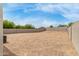 Large backyard with gravel landscaping and block wall providing space and privacy at 30390 W Mitchell Ave, Buckeye, AZ 85396
