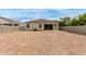 Large backyard featuring gravel landscaping, perfect for low-maintenance living and customization at 30390 W Mitchell Ave, Buckeye, AZ 85396