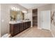 Spacious bathroom featuring double vanity, sleek countertops, and modern fixtures at 30390 W Mitchell Ave, Buckeye, AZ 85396