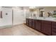 Bright bathroom with double sinks, a spacious shower, and modern fixtures at 30390 W Mitchell Ave, Buckeye, AZ 85396