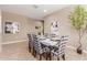Stylish dining room featuring tile floors, decorative tree, and modern accents at 30390 W Mitchell Ave, Buckeye, AZ 85396
