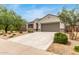 Beautiful single-story home with desert landscaping, a two-car garage, and inviting curb appeal at 30390 W Mitchell Ave, Buckeye, AZ 85396