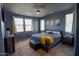 This spacious bedroom offers natural light, a modern ceiling fan and a cozy atmosphere at 324 N 56Th Pl, Mesa, AZ 85205
