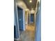 Hallway featuring tile flooring, recessed lighting, and access to rooms at 324 N 56Th Pl, Mesa, AZ 85205