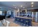 Beautiful kitchen featuring a large island with seating, dark wood cabinetry, and stainless steel appliances at 324 N 56Th Pl, Mesa, AZ 85205