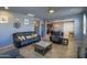 Open-concept living room with tile flooring, neutral paint, and furniture perfect for lounging and entertaining at 324 N 56Th Pl, Mesa, AZ 85205