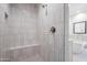 Modern tiled shower with built-in bench, alongside an elegant soaking tub at 3332 S Quinn Ave, Gilbert, AZ 85297