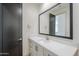 Bathroom featuring vanity with quartz countertops, modern fixtures and dark door at 3332 S Quinn Ave, Gilbert, AZ 85297