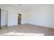 Bedroom featuring wood floors and a doorway to a bathroom at 3332 S Quinn Ave, Gilbert, AZ 85297