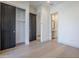 Bedroom with closet and entry to bathroom with white marble countertop at 3332 S Quinn Ave, Gilbert, AZ 85297