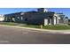 New home features desert landscaping, nice sidewalks, irrigation, and fire hydrant in a modern design at 3332 S Quinn Ave, Gilbert, AZ 85297
