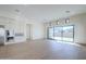 Bright and spacious living room with an open floor plan and large windows providing abundant natural light at 3332 S Quinn Ave, Gilbert, AZ 85297