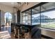 Modern lobby featuring bar seating beneath pendant lights and large windows offering neighborhood views at 3332 S Quinn Ave, Gilbert, AZ 85297