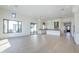 Bright open floorplan featuring a modern kitchen, large windows, and hardwood floors, creating an airy and inviting space at 3332 S Quinn Ave, Gilbert, AZ 85297