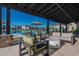 Outdoor seating area with modern furniture near the community pool at 3332 S Quinn Ave, Gilbert, AZ 85297