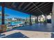 Covered patio area providing a view of the community pool and seating at 3332 S Quinn Ave, Gilbert, AZ 85297