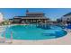 Community pool area featuring clear blue water and an attractive building backdrop on a clear day at 3332 S Quinn Ave, Gilbert, AZ 85297