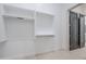 Bright, spacious walk-in closet with custom shelving and hanging rods at 3332 S Quinn Ave, Gilbert, AZ 85297