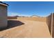 An expansive, enclosed backyard providing privacy and ample space for various outdoor activities at 335 S San Gregorio Ln, Casa Grande, AZ 85194