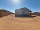 Spacious backyard with a covered patio, perfect for outdoor entertaining and relaxation at 335 S San Gregorio Ln, Casa Grande, AZ 85194
