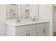 Bathroom with double sink vanity, tile flooring, large mirror and closet access at 335 S San Gregorio Ln, Casa Grande, AZ 85194