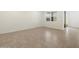 Bedroom with tile flooring, a window and a sliding glass door at 335 S San Gregorio Ln, Casa Grande, AZ 85194