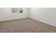 Bright bedroom featuring neutral carpet and ample natural light at 335 S San Gregorio Ln, Casa Grande, AZ 85194