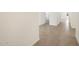 View of the hallway featuring light grey tile and white walls at 335 S San Gregorio Ln, Casa Grande, AZ 85194