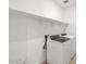 Well-lit laundry room with modern appliances and convenient shelving at 335 S San Gregorio Ln, Casa Grande, AZ 85194