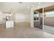 Open floorplan with sliding doors to patio, adjacent to the kitchen at 335 S San Gregorio Ln, Casa Grande, AZ 85194