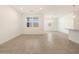 Open-concept living area with neutral tile, connecting to the kitchen at 335 S San Gregorio Ln, Casa Grande, AZ 85194